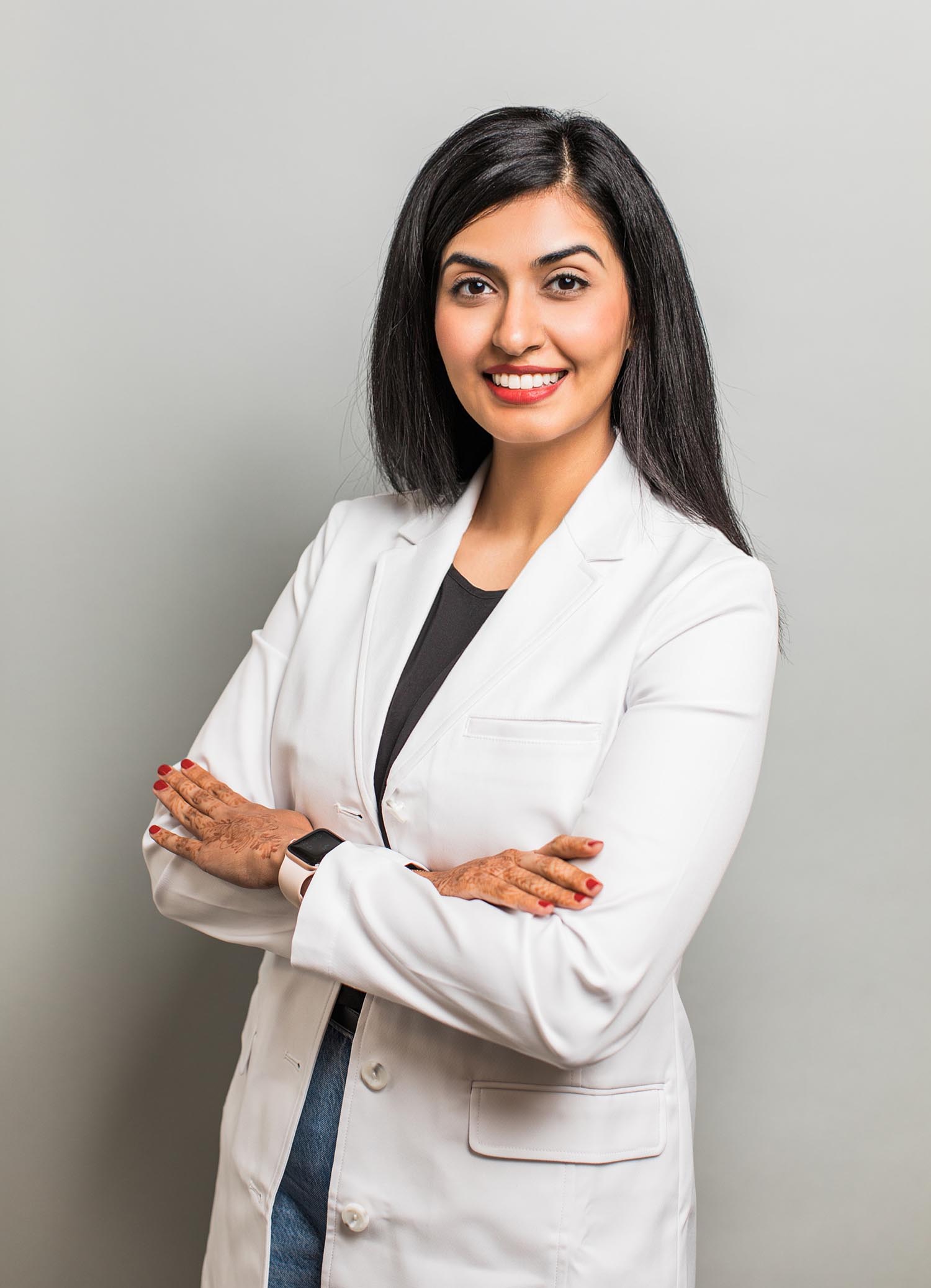 Dr. Uzma Hajiyani in white coat at Lucas Elite Dental Studio