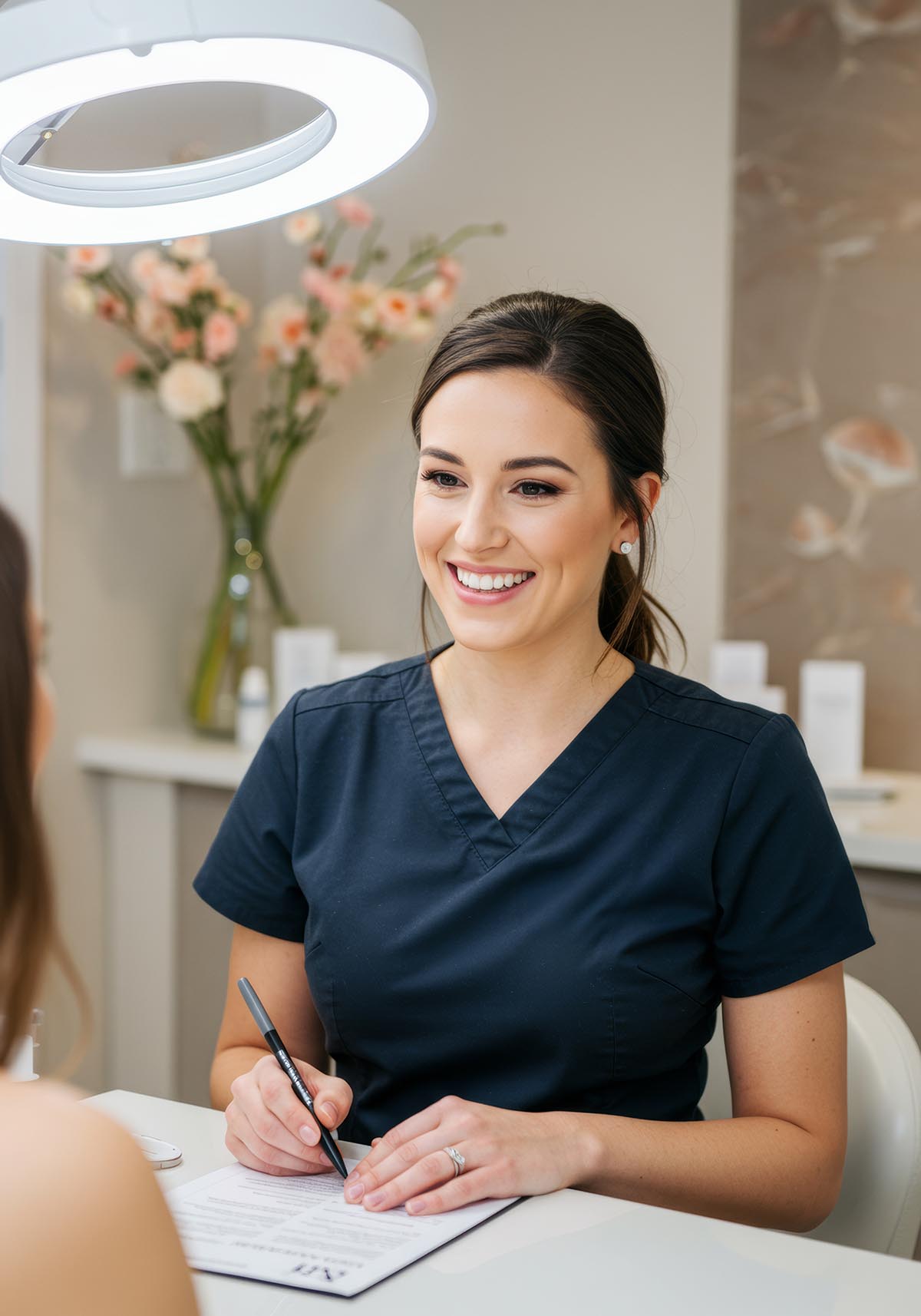 Friendly dental team at the front desk of Lucas Elite Dental Studio